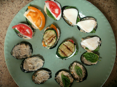 stack-stages the stages of assembly starting counter clockwise with hummus covered eggplant to center finished stack