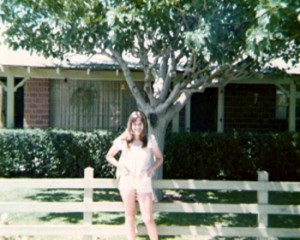 Sheri in front of my childhood home in the summer of '75