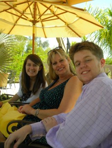 Marissa, Sloane, and Connor in the shade at Easter Brunch