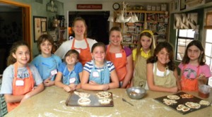 Nine of the 10 kids from week 1 - with their creative individual pizzas